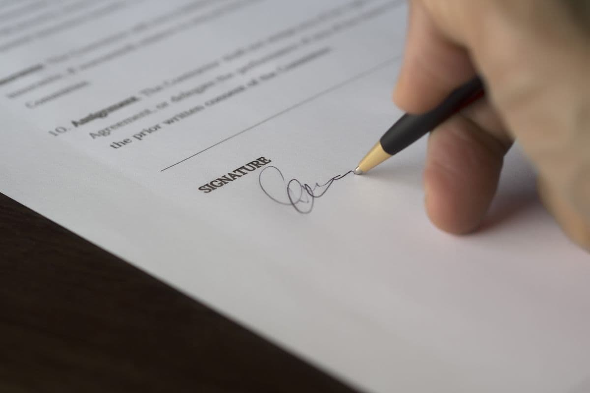 Signing a contract with a pen