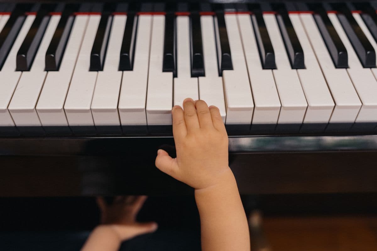 A child at a piano lesson