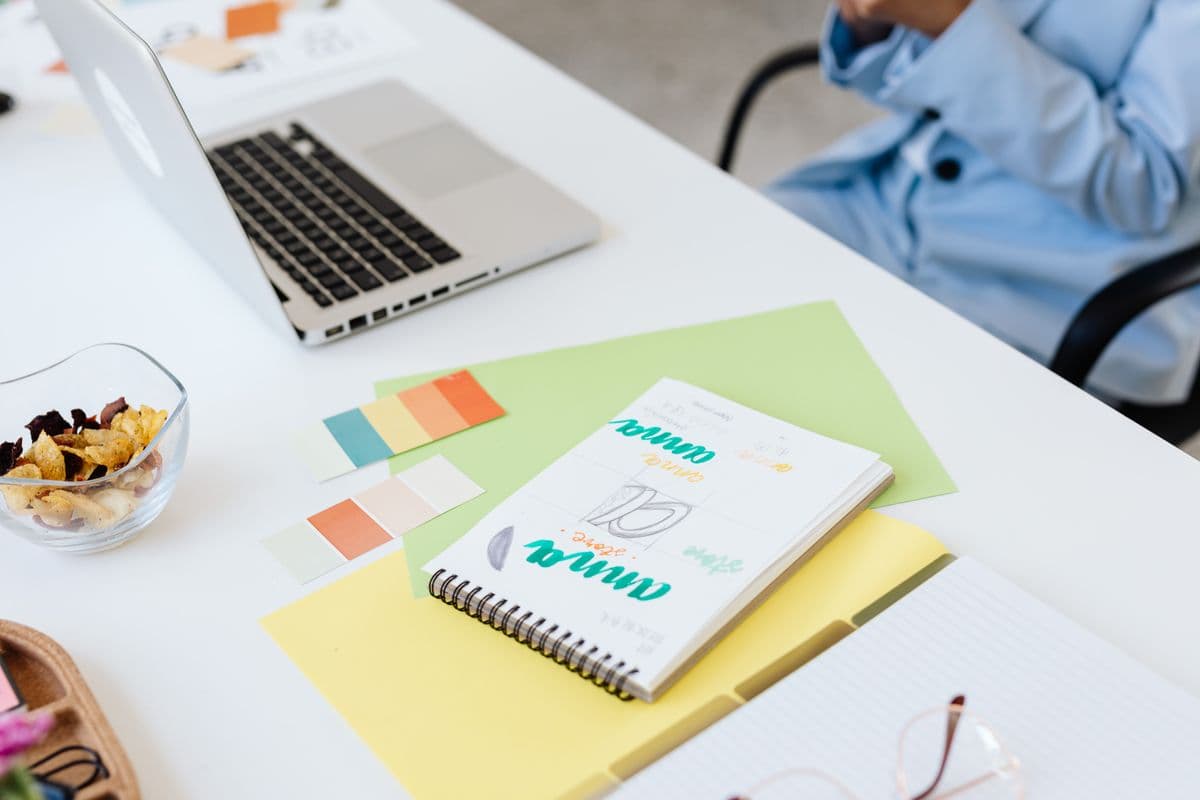 A graphic designer's desk with color swatches